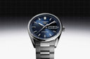 Men's stainless steel watch with blue dial, day-date display, and silver hour markers